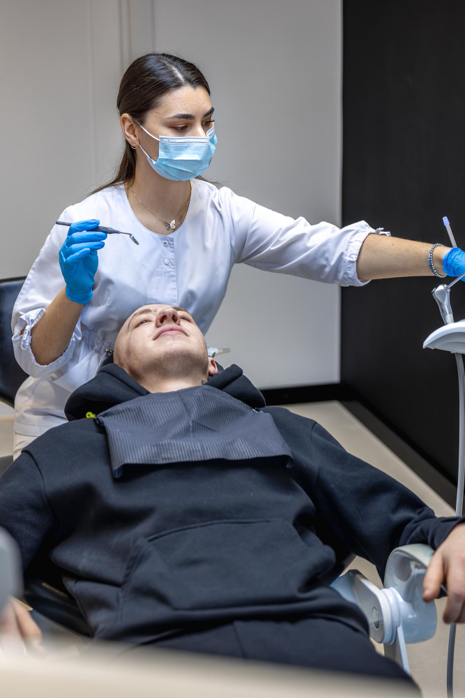 Patient comfortably undergoing sedation dentistry procedure with experienced dentist in Denver.