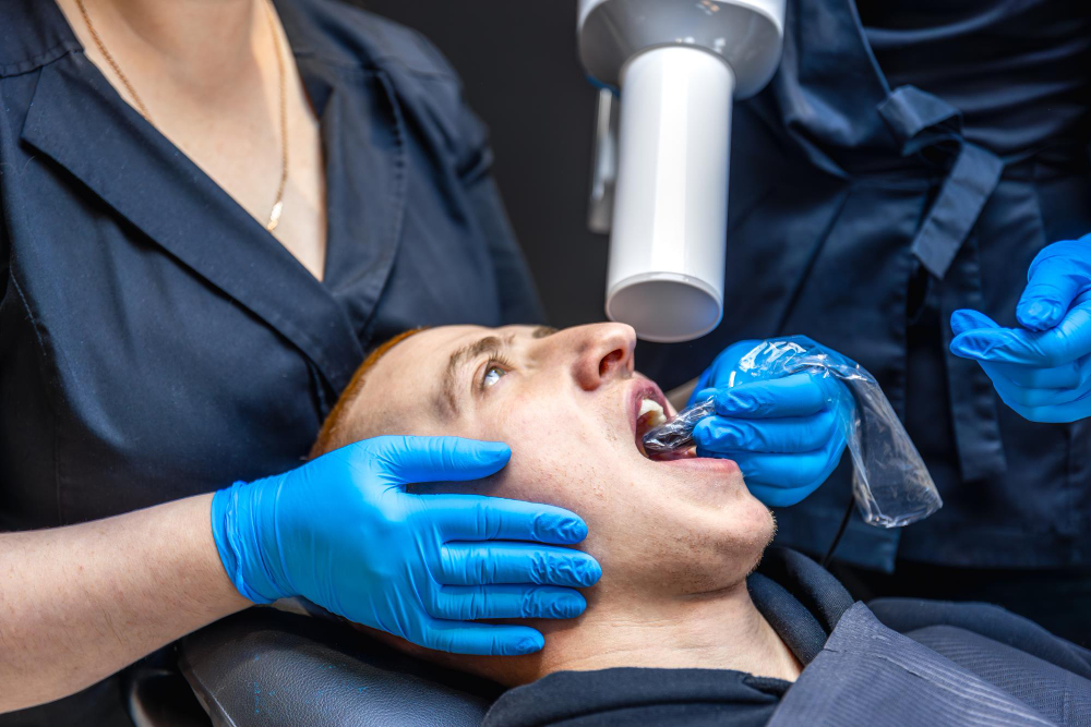 Dentist using modern sedation technology to ensure pain-free dental care in Denver.