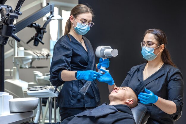 Dental team performing a Cosmetic Dentistry in Denver procedure on a patient.