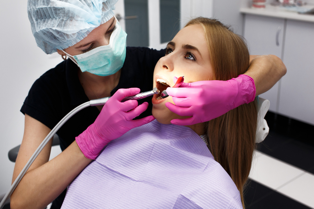 Dentist performing Root Canal Therapy in Denver to relieve tooth pain and save a damaged tooth.