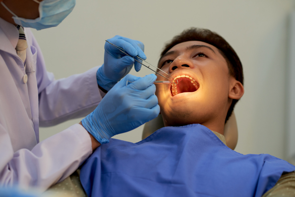 Dentist performing a tooth restoration procedure as part of Restorative Dentistry in Denver.