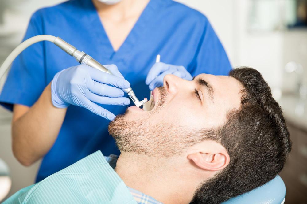 Patient undergoing root canal procedure at a Denver dental clinic for severe tooth infection.