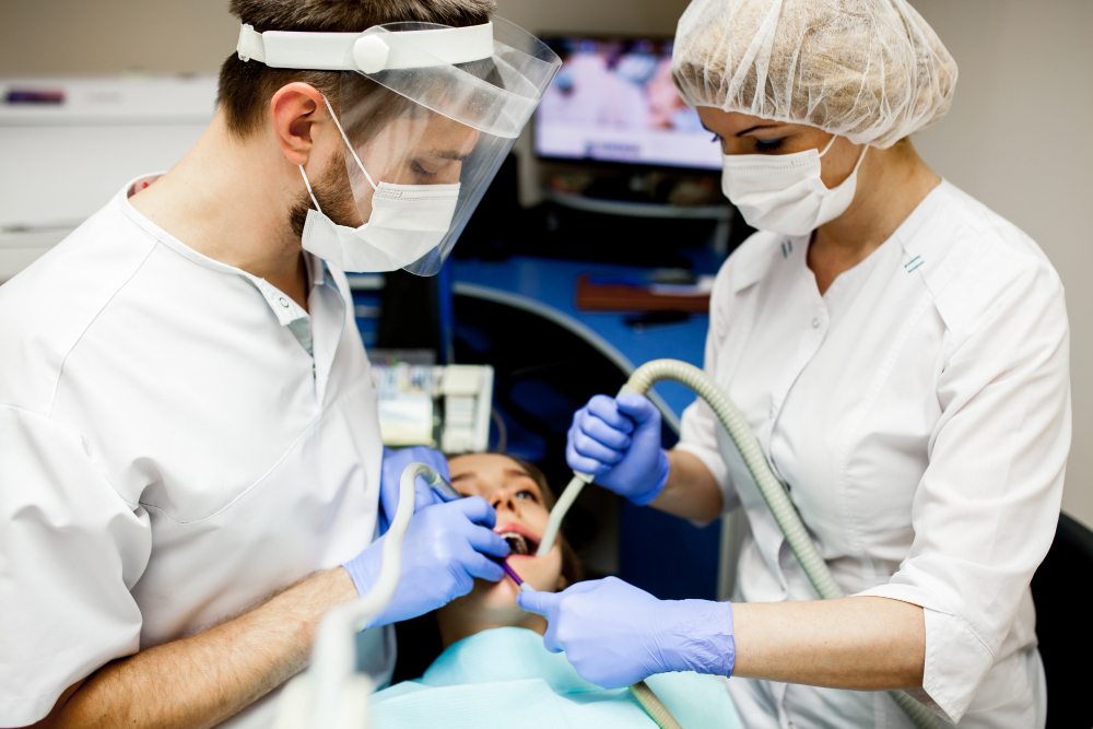 Endodontic specialist carefully cleaning and sealing a tooth during root canal therapy.
