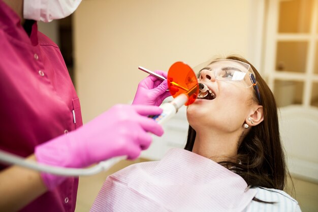 Patient receiving restorative dental care to repair damaged teeth in Denver.