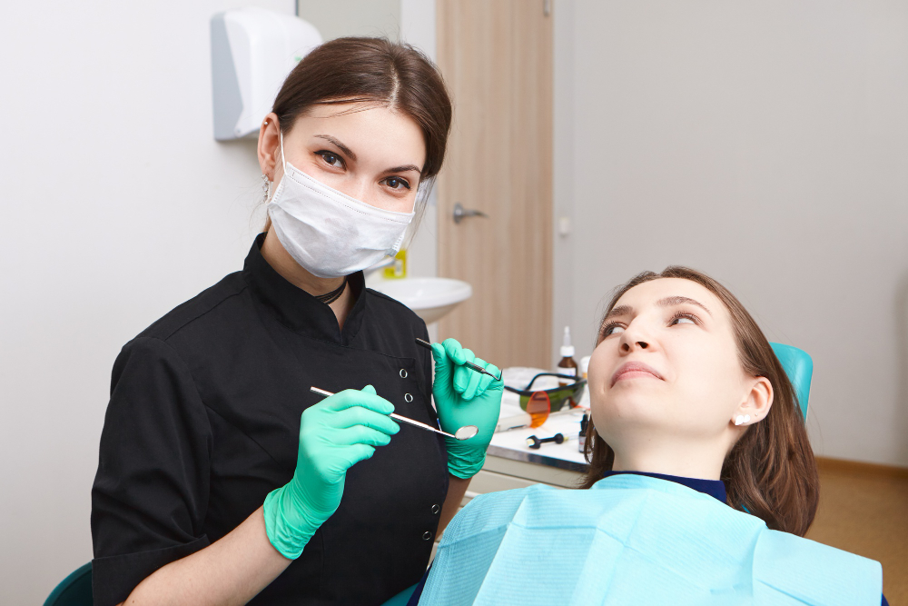 Dental hygienist performing routine cleaning as part of preventive dentistry services in Denver.