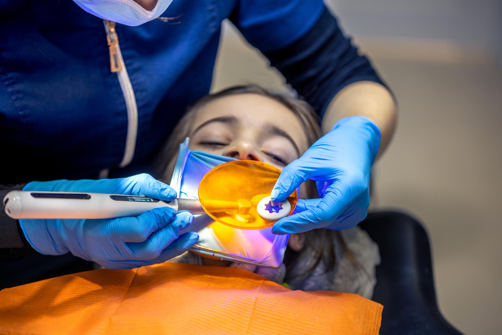 Patient receiving soft tissue laser treatment as part of laser dentistry Denver services.